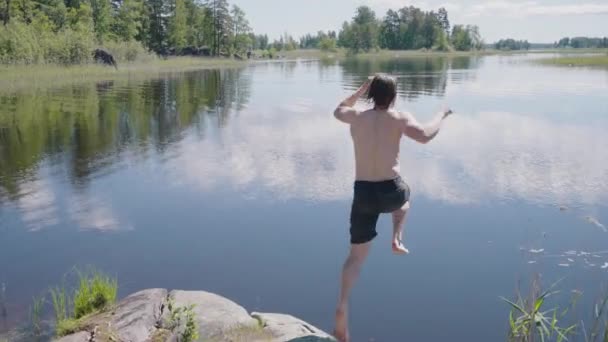 Young Man Bare Torso Jumps Water Bank Rock Guy Black — Vídeos de Stock