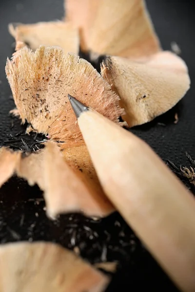 Sharpened pencil and wood shavings — Stock Photo, Image