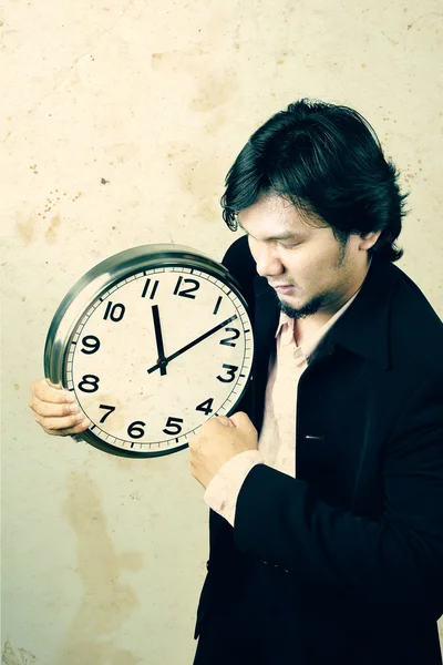 Businessman angry the clock — Stock Photo, Image
