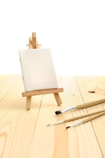 Blank canvas on easel — Stock Photo, Image