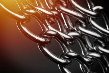 abstract stainless steel chain in low light