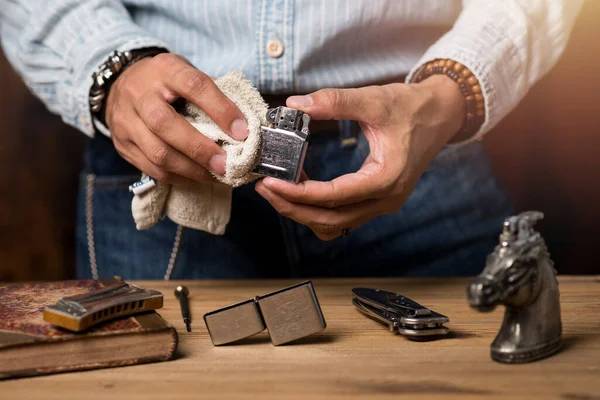 Man Cleaning His Chrome Lighter Refilled — Stock Photo, Image