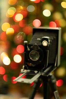 Eski model kamera Noel 'de Üç ışık Bokeh bayramı