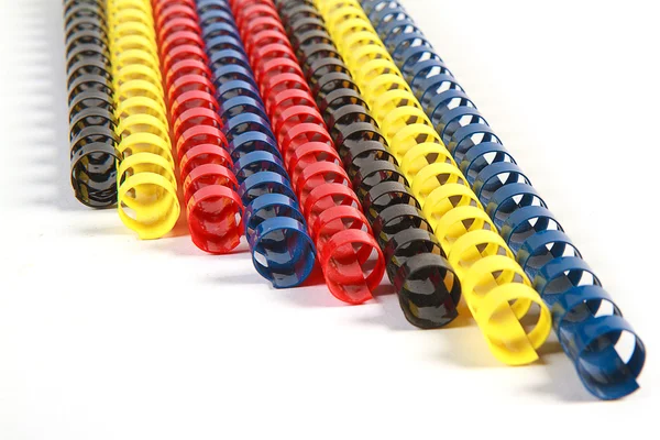 Colorful plastic multi-ring paper binding spine on white backgro — Stock Photo, Image