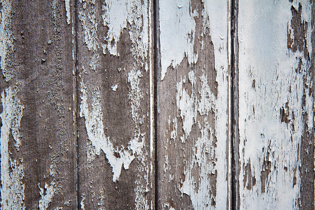 A rotting wooden door with peeling paint — Stock Photo © noomHH 13183715