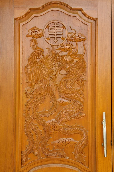 Fish carve in temple door — Stock Photo, Image