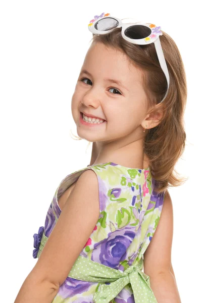 Cheerful little girl looks back — Stock Photo, Image
