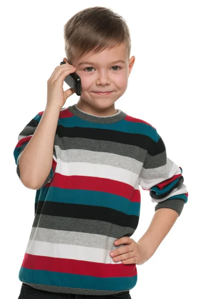 Niño con un teléfono celular — Foto de Stock