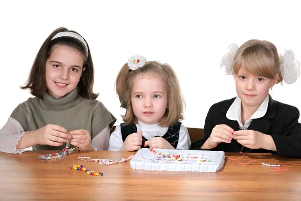 Três meninas ocupadas com artesanato — Fotografia de Stock