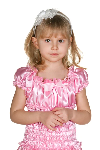 Задумчивая маленькая девочка в розовом — стоковое фото