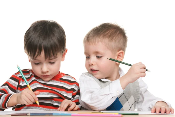 Little boys write at the desk Stock Photo