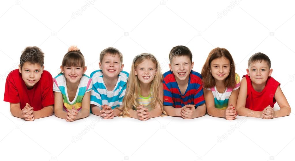 Seven children lying on floor