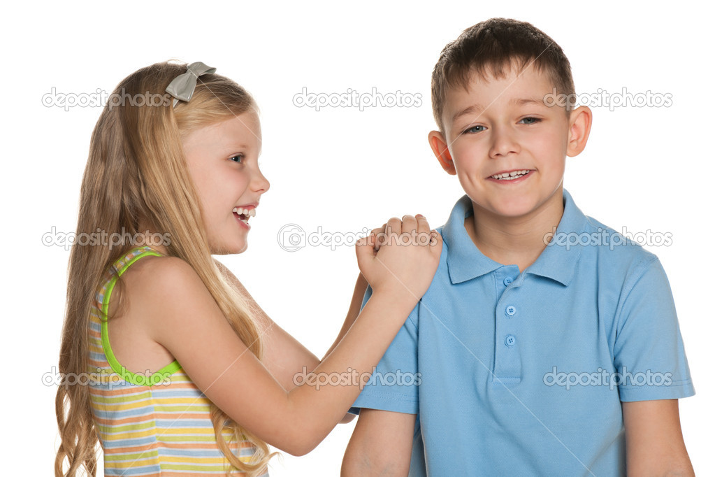 Laughing boy and girl are standing together