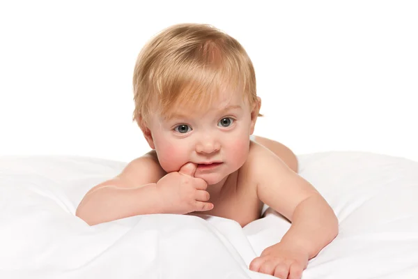 Thoughtful baby boy in the bed — Stock Photo, Image