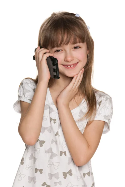 Menina bonita com um telefone celular — Fotografia de Stock