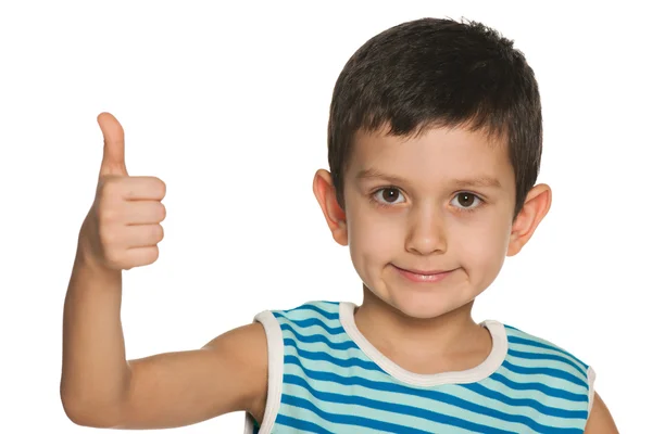 Closeup portrait of a boy holds his thumb up — Stock Photo, Image