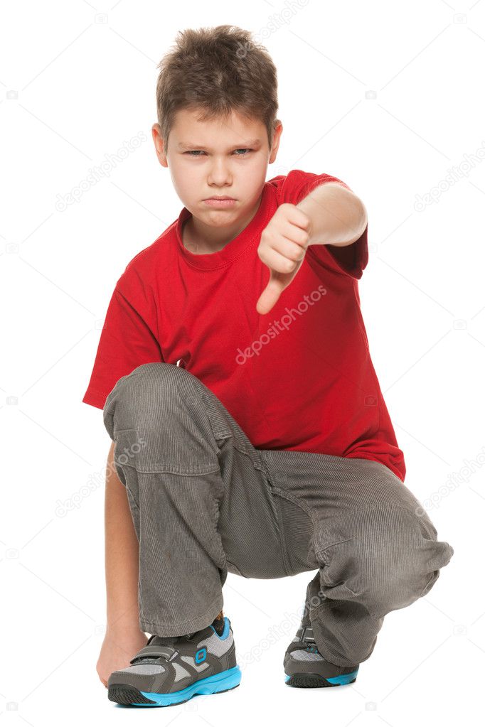 Upset boy holds his thumb down