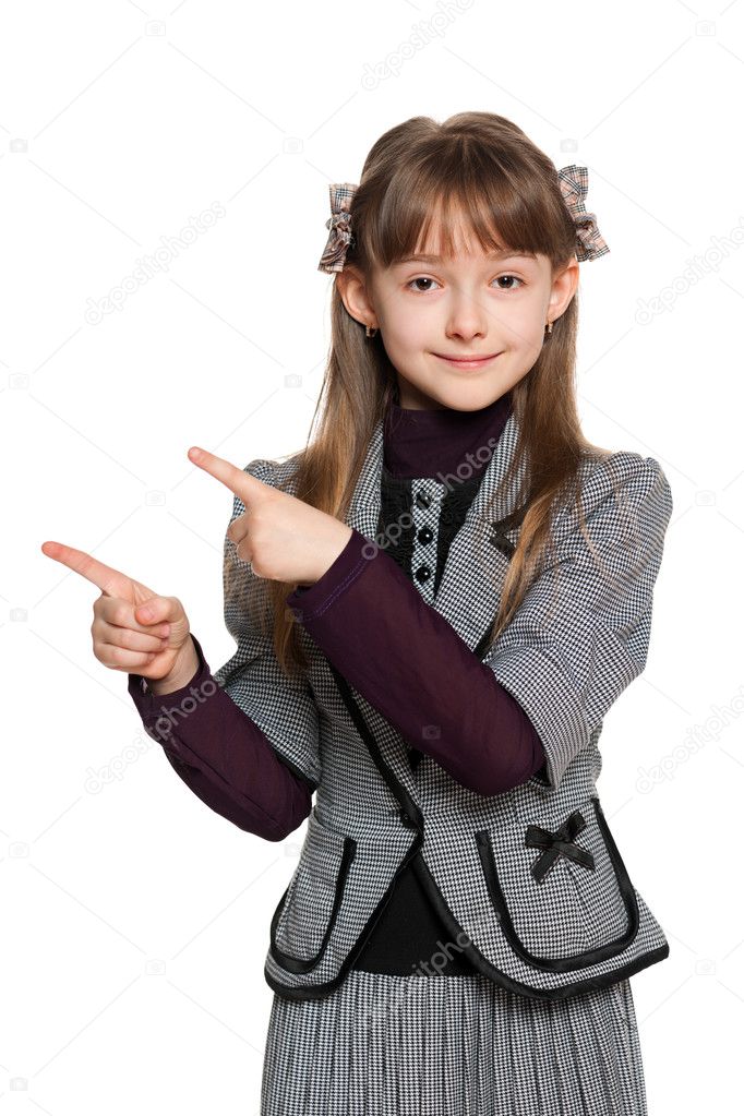 Young girl shows her finger to the side
