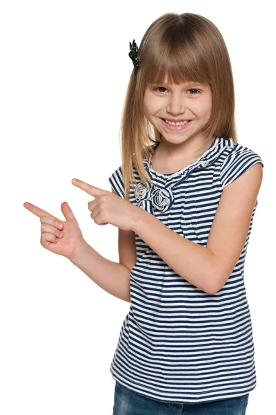 Laughing girl shows her fingers to the side — Stock Photo, Image