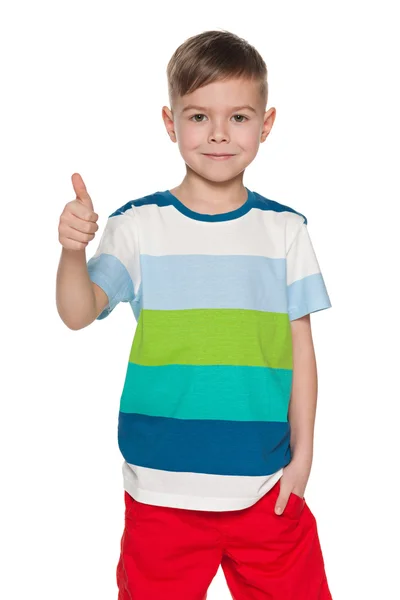 Cute young boy holds his thumb up — Stock Photo, Image