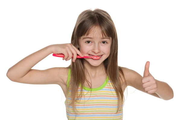 Pretty young girl brushing her teeth — Stock Photo, Image