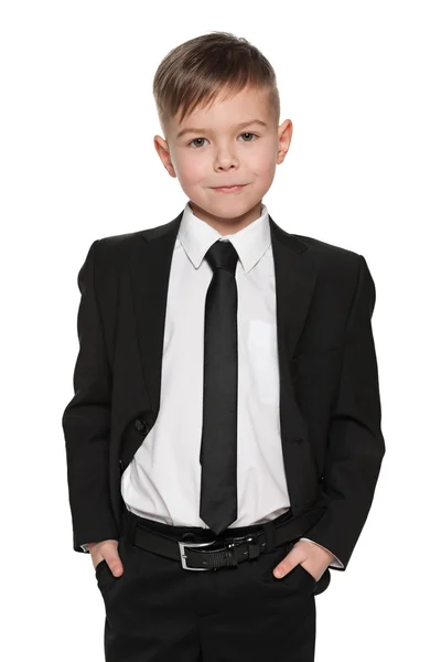 Handsome young boy in black suit — Stock Photo, Image