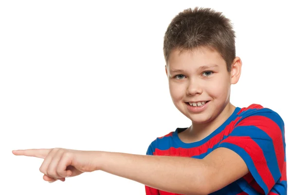 Young boy shows her finger to the side — Stock Photo, Image