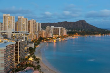 Night view on Honolulu city and Waikiki Beach clipart