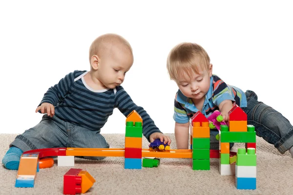 Two baby boys are playing — Stock Photo, Image