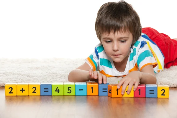 Clever boy with blocks on the floor — Stock Photo, Image