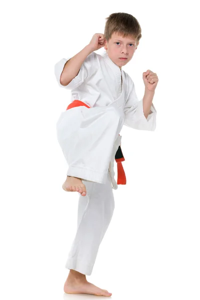 Young boy in kimono in fighting stance — Stock Photo, Image