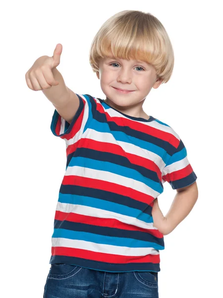 Alegre niño sosteniendo su pulgar hacia arriba — Foto de Stock