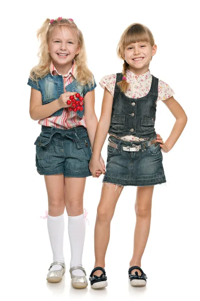 Little cheerful girls with red berries — Stock Photo, Image