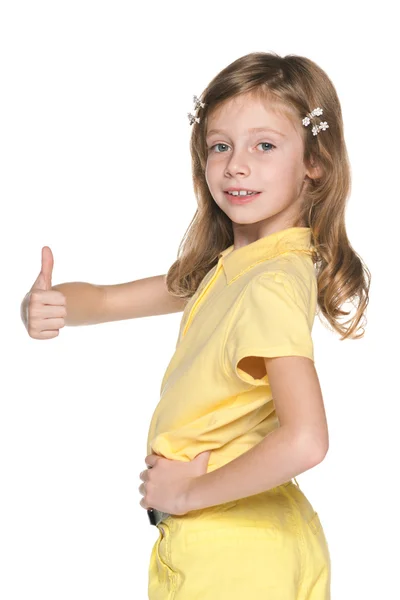 Girl in yellow blouse holds her thumb up — Stock Photo, Image