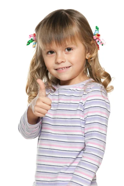 Smiling small girl with her thumb up — Stock Photo, Image