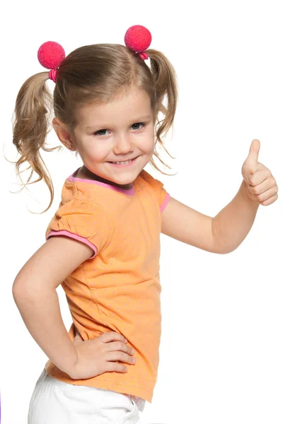 Meisje in oranje blouse houdt haar duim omhoog — Stockfoto