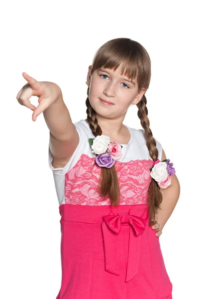 Young girl pointing forward — Stock Photo, Image