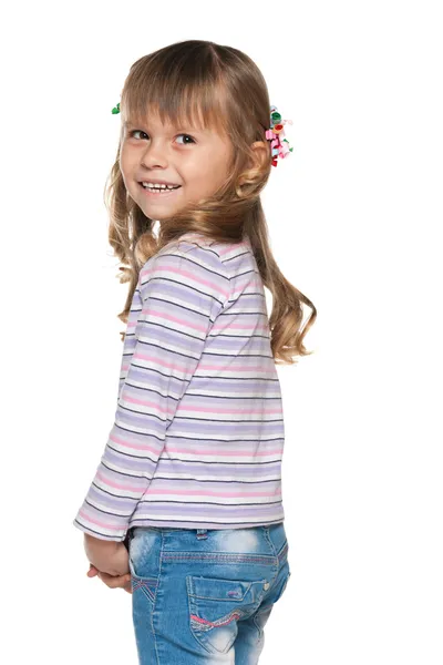 Joyful little girl looks back — Stock Photo, Image