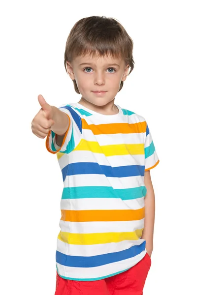 Lindo niño sostiene su pulgar hacia arriba —  Fotos de Stock
