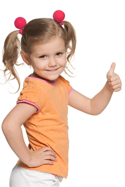 Girl in orange blouse holding thumb up — Stock Photo, Image