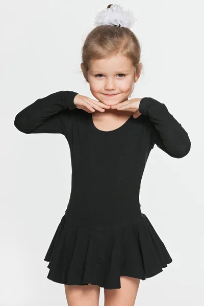 Little dancing girl on the grey background — Stock Photo, Image