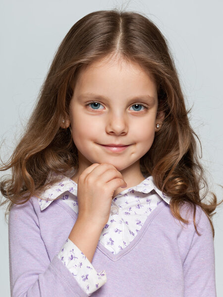 Closeup portrait of a pretty smiling little girl