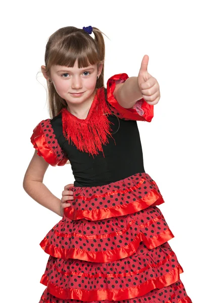 Young girl in red with her thumb up — Stock Photo, Image