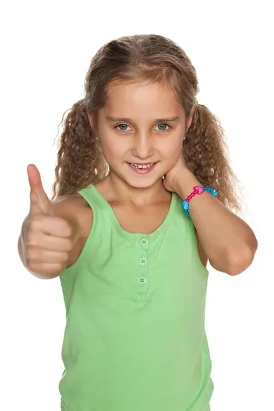 Pretty smiling girl holds her thumbs up — Stock Photo, Image