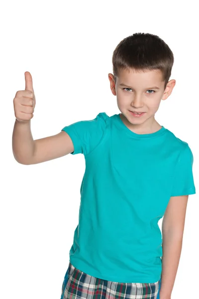 Young smiling boy holds his thumb up — Stock Photo, Image