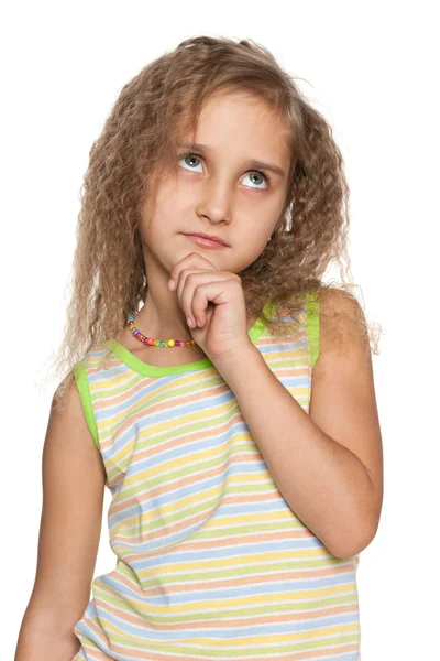 Pensive little girl with flowing hair — Stock Photo, Image