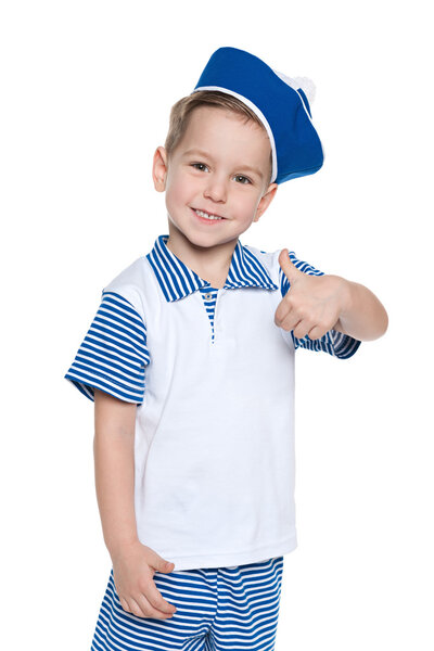 Llittle cheerful boy in a sailor suit