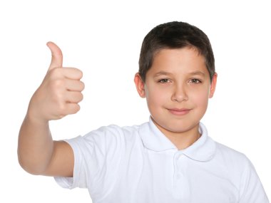 Beyaz gömlekli preteen çocuğun parmağını havaya