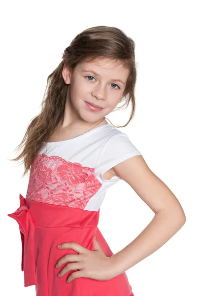 Young girl in red dress against the white — Stock Photo, Image