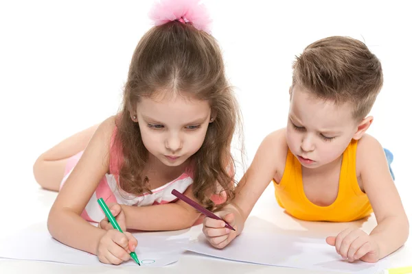 Children are drawing on paper Royalty Free Stock Photos